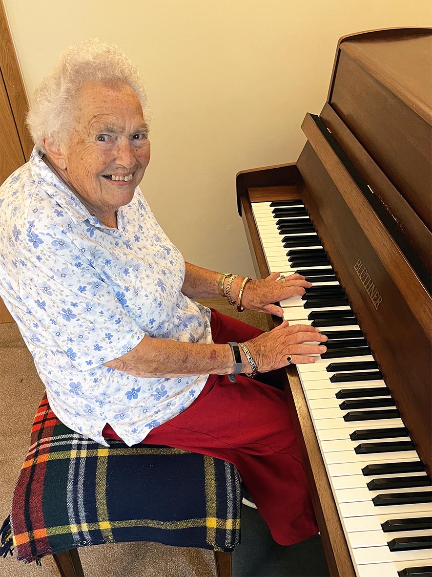 Susan Moser Sue at the piano in Fairfield's lounge.